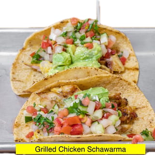 Grilled Chicken Shawarma Tacos, Avocado Hummus, Israeli Salad, Tahini