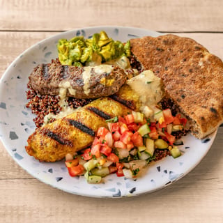Mixed Grilled Kebab, Avocado Hummus, Israeli Salad, Tahini, 1/2 Pita