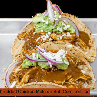 Shredded Chicken Mole Tacos, Pickled Onions, Avocado Hummus, Shredded PB Cheese