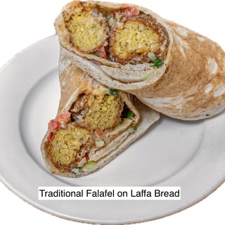 Traditional Chickpea Falafel, tahini, hummus, israeli salad